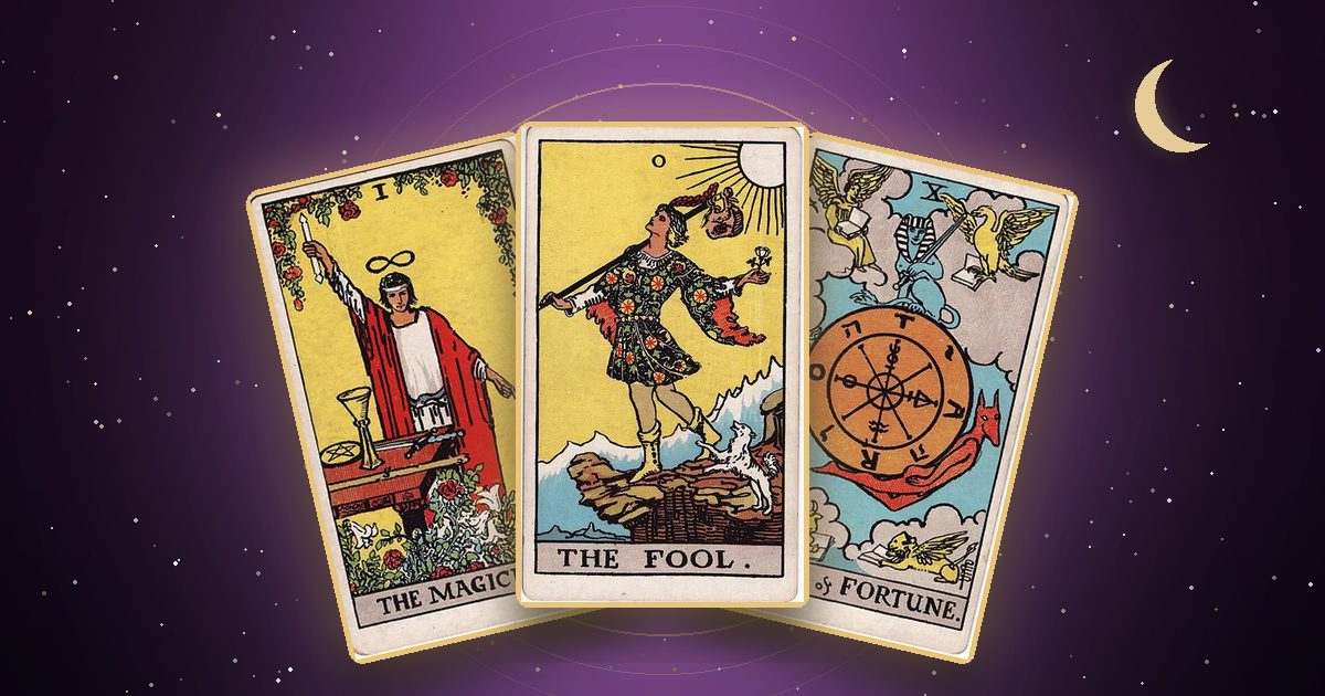 The Magician, The Fool and Wheel of Fortune tarot cards under a night sky